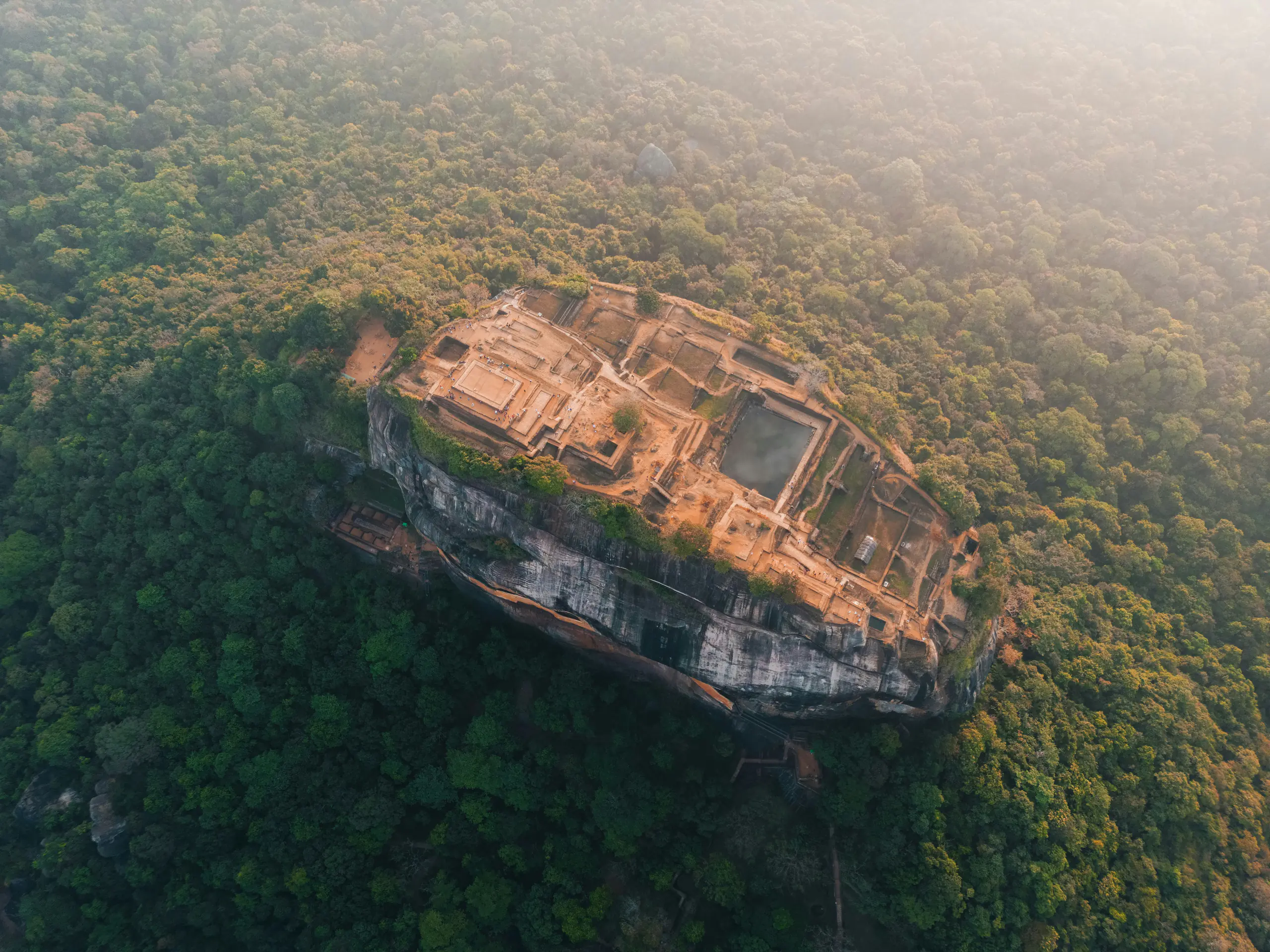 Sigiriya rock fortress rising above the forest
